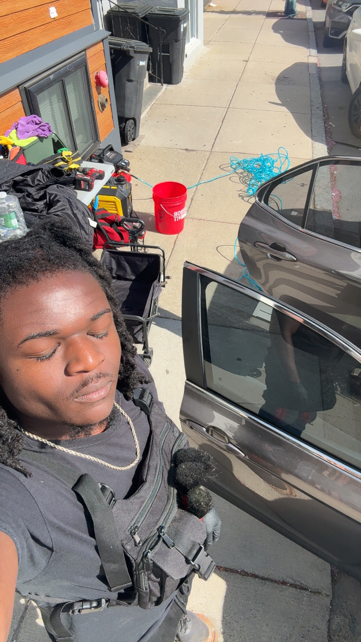 Owen Uyi-Osagie working on a mobile detailing job